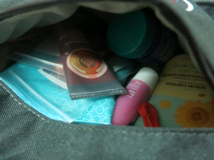 Small pocket that can hold quite a lot of small items. I have my hand cream, sunblock, lip balm, wet tissues, medicine and a bottle of 